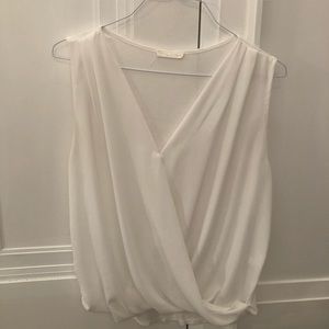 White “wrap style” sleeveless blouse